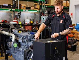 Pete Shaw working on a diesel engine